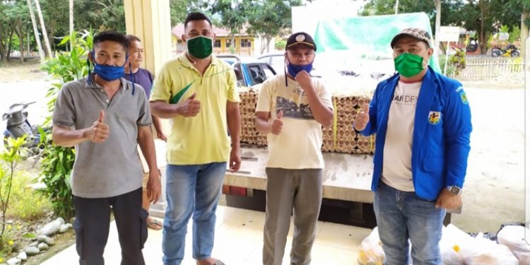 KNPI Bolmong Dampingi Penyaluran Bahan Kebutuhan Pokok