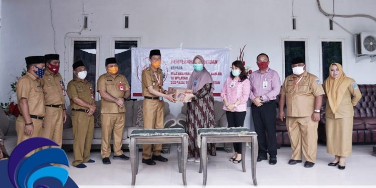 Pemkab Bolsel Terima Bantuan dari BSG Untuk Korban Banjir