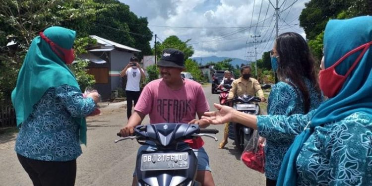 TP-PKK Bolmong Gebrak Masker di Passi Barat