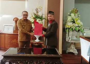Pj Bupati Bolmong Limi Mokodompit Lantik Herman Kembuan Sebagai Dirut PDAM