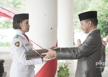 Pemkab Bolmong Menggelar Upacara Pemindahan Duplikat Bendera Merah Putih