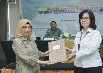 Pj Bupati Menghadiri Penyerahan Hasil Pengadaan Tanah Pembangunan Bendungan Lolak